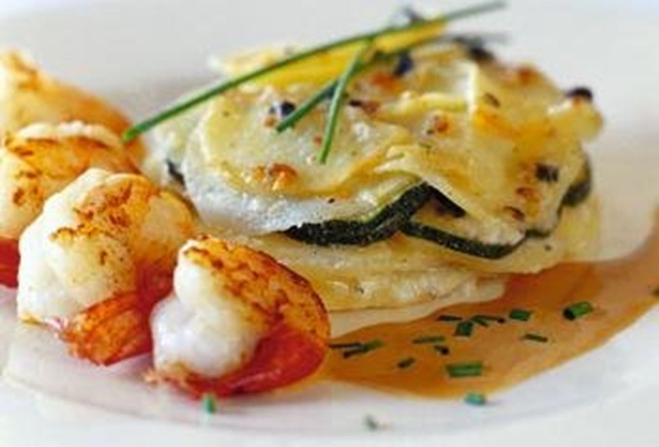 recipe image Gebakken scampi's met een gratin van courgettes